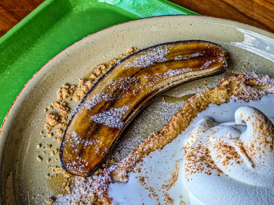 French toast served with syrup-drizzled bananas