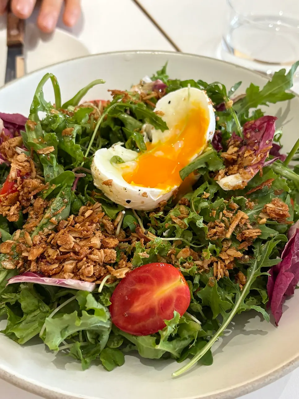 Close-up of the salad with dressing and granola