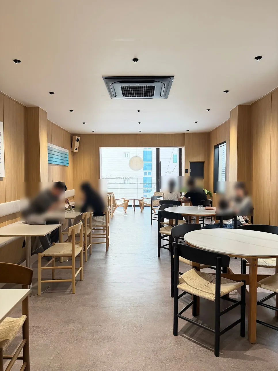 2nd floor table with wood-toned furniture and lighting