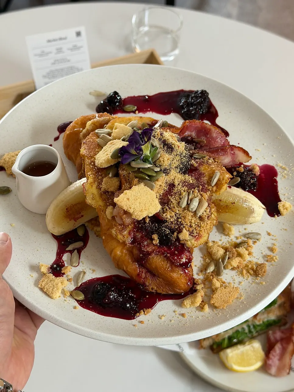 Plating of the croissant-based French toast