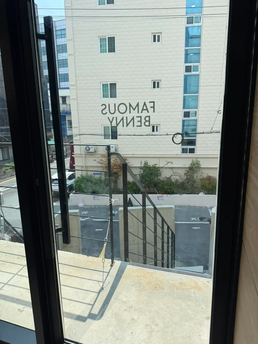 Standalone window seat with full glass wall on the second floor of Famous Benny
