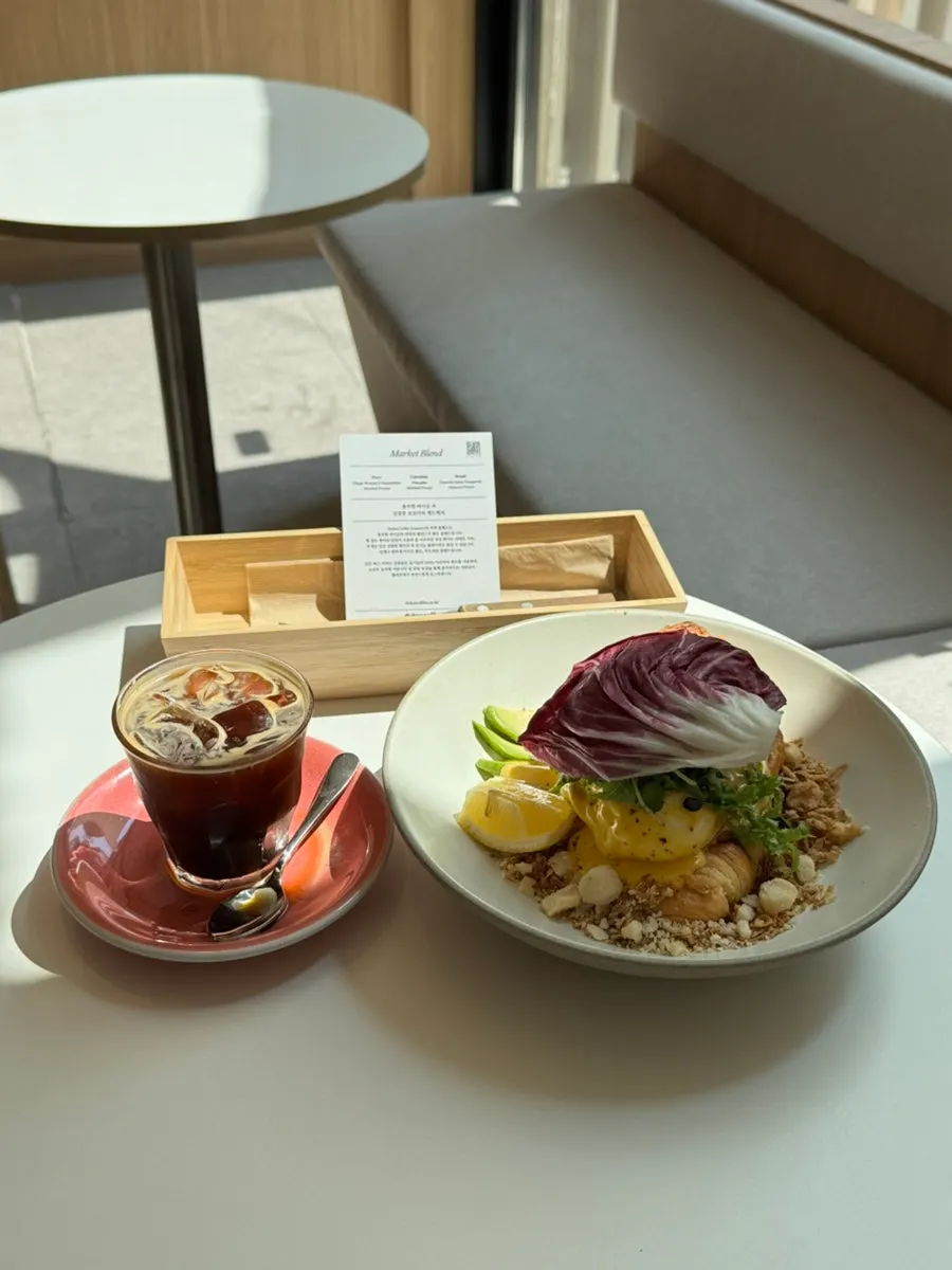 Salmon benny and iced long black brunch setting