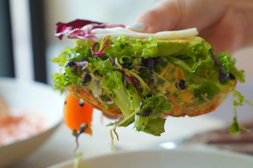 Close-up of salmon and poached egg on the croissant