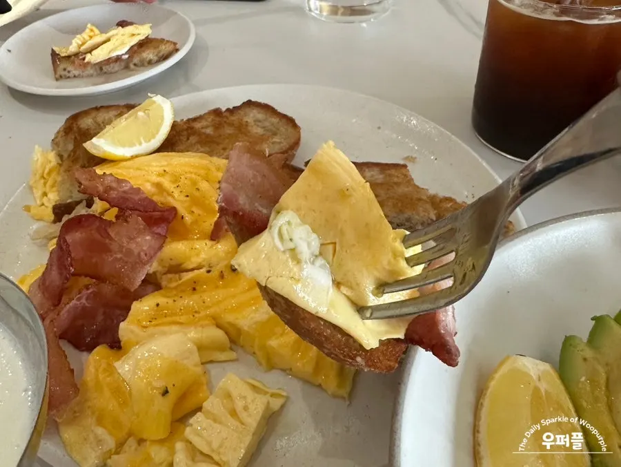Crispy fried sourdough topped with bacon and scrambled egg