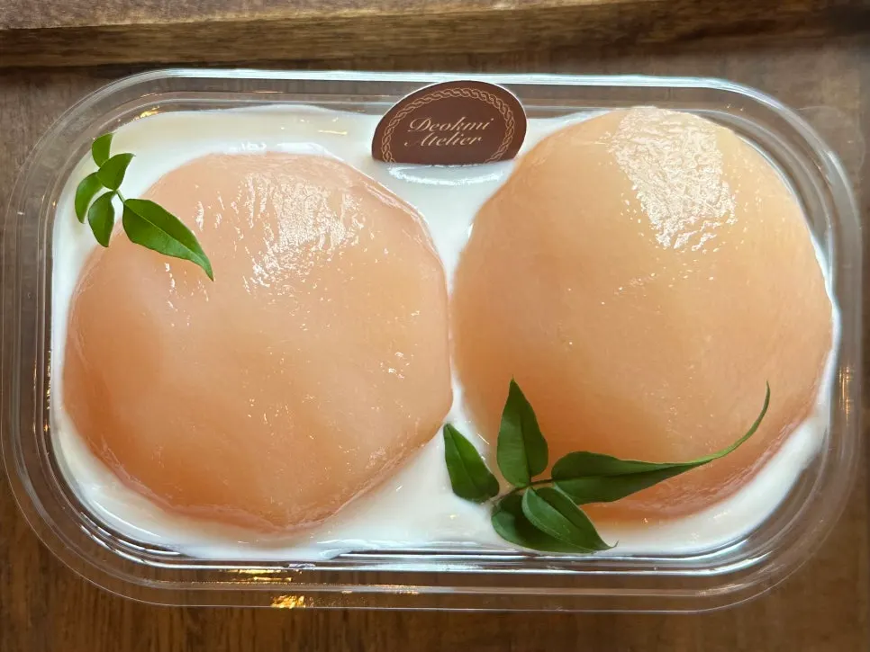 Tiramisu topped with a pink peach garnish