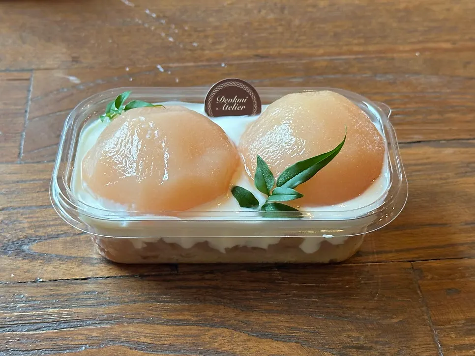 Close-up of the peach-shaped garnish on the tiramisu