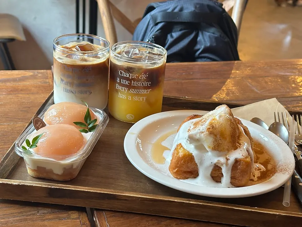 Peach tiramisu served alongside coffee