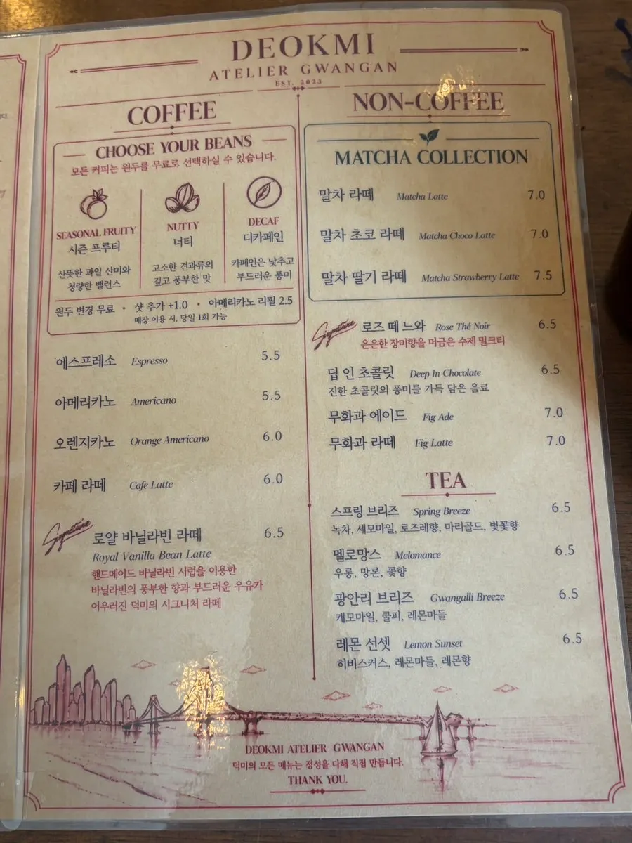 Menu board listing tiramisu and drinks
