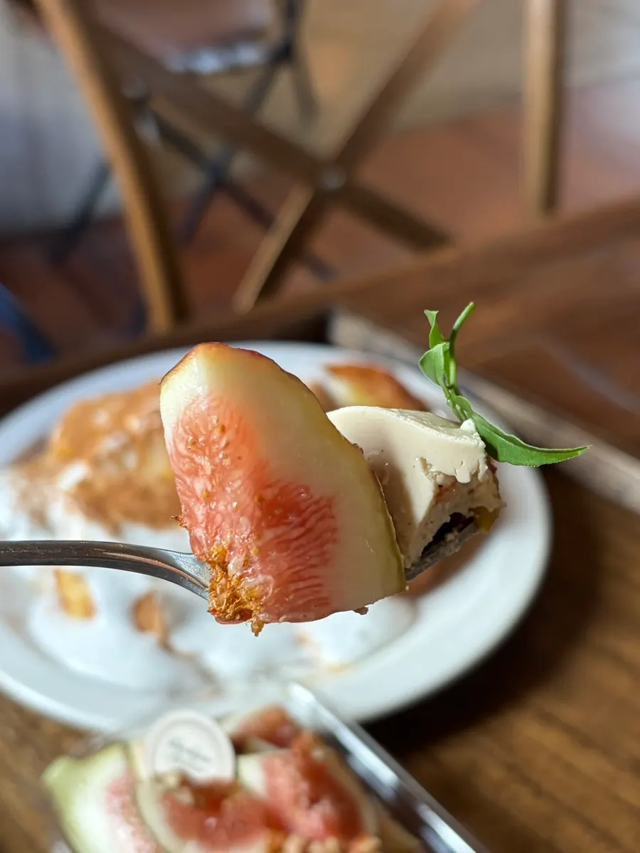 Cross-section of tiramisu topped with seasonal figs