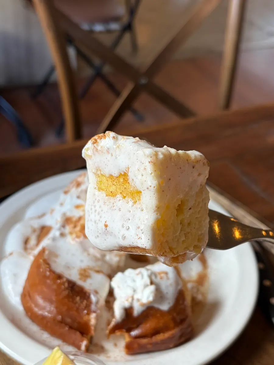 A piece of French toast dipped in cream