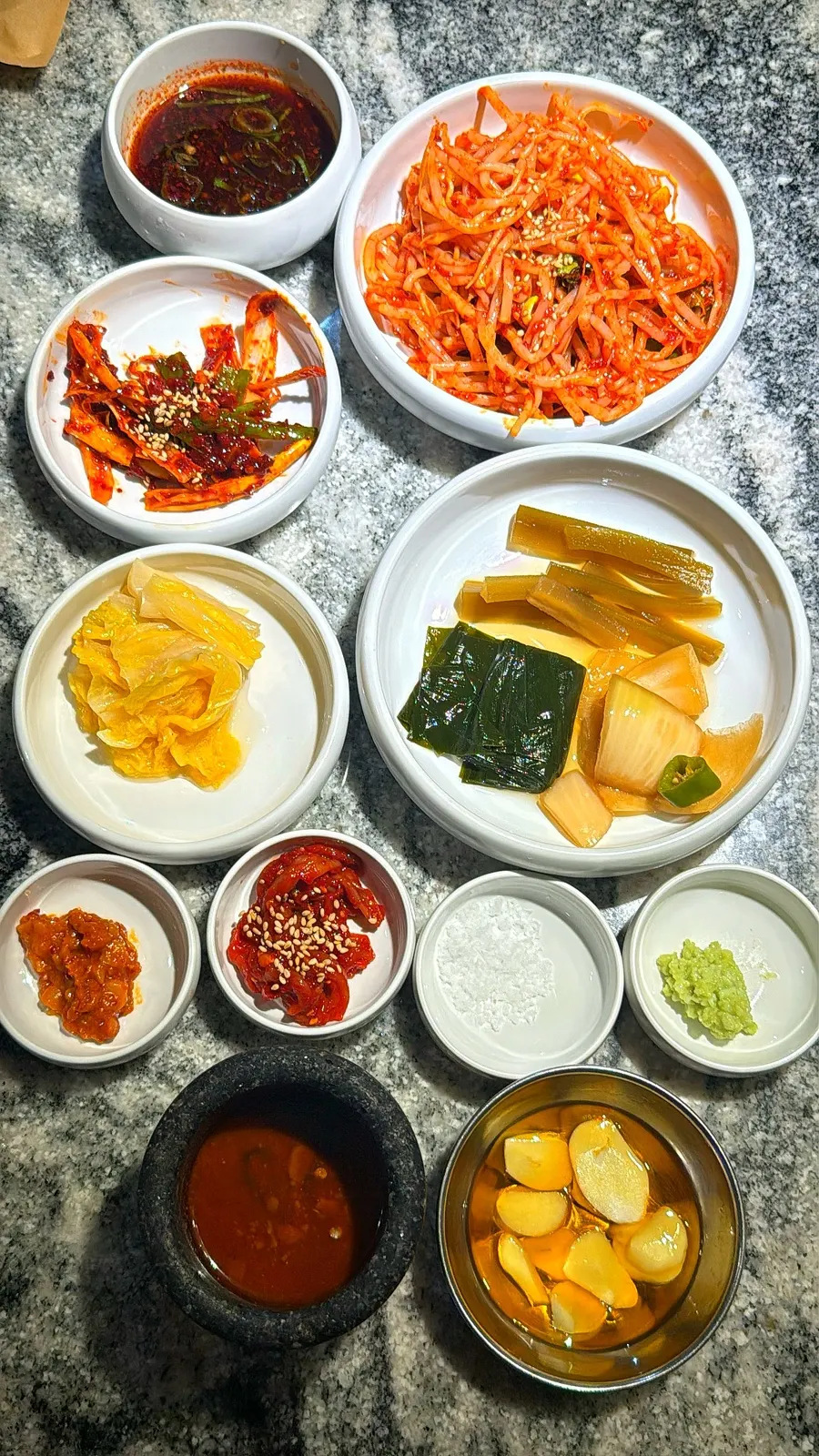 Basic side dishes including bean sprout salad and white kimchi