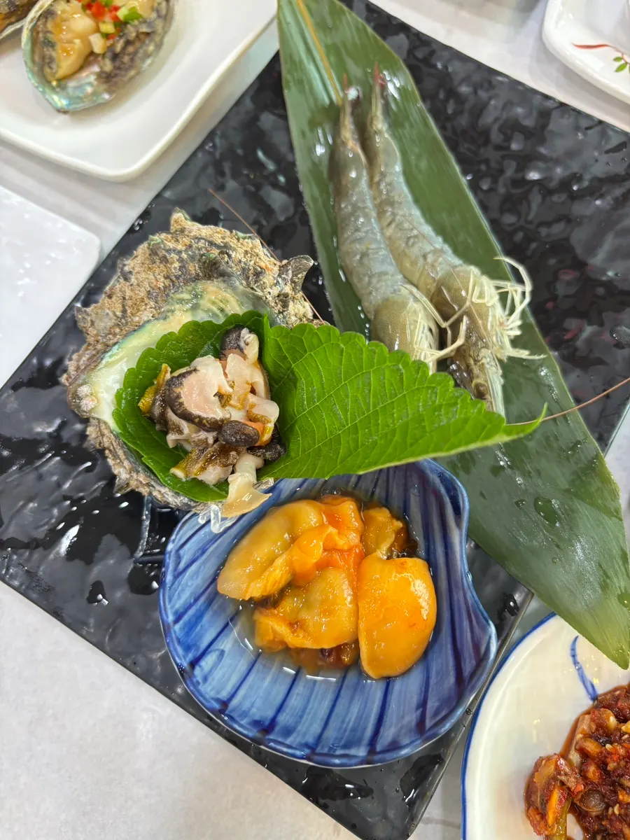 Table filled with Part 1 seafood dishes