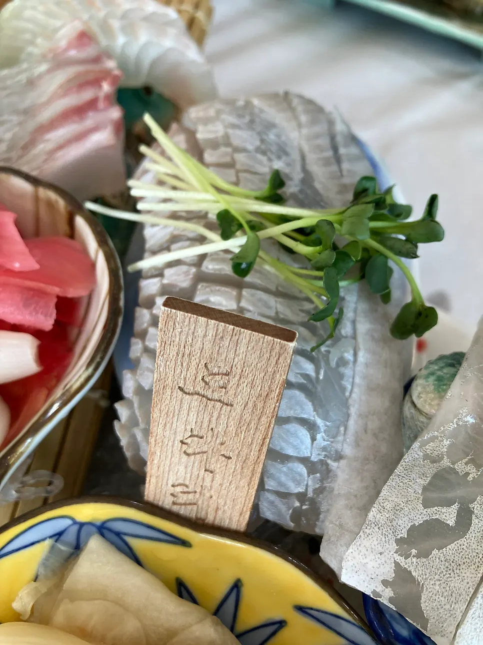 Gwanganda Jjji mixed sashimi platter with name tags
