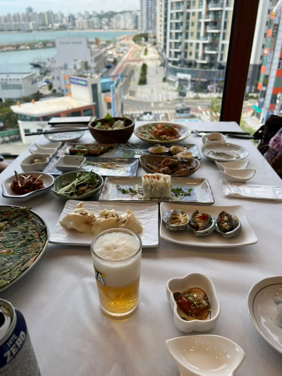 First spread with seasoned cockles and soy-marinated crab