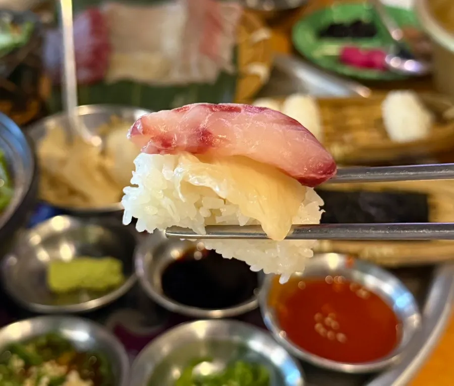 Sashimi wrapped in seaweed with aged kimchi