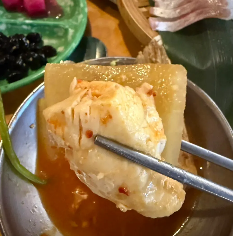 Spicy fish stew served alongside the sashimi set