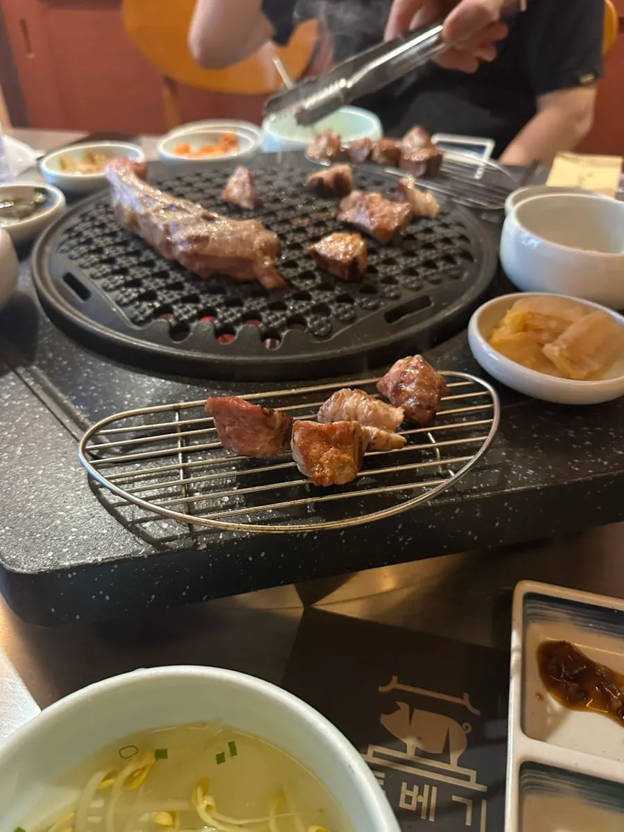 Grilled shoulder rack topped with myeongran and baek-kimchi