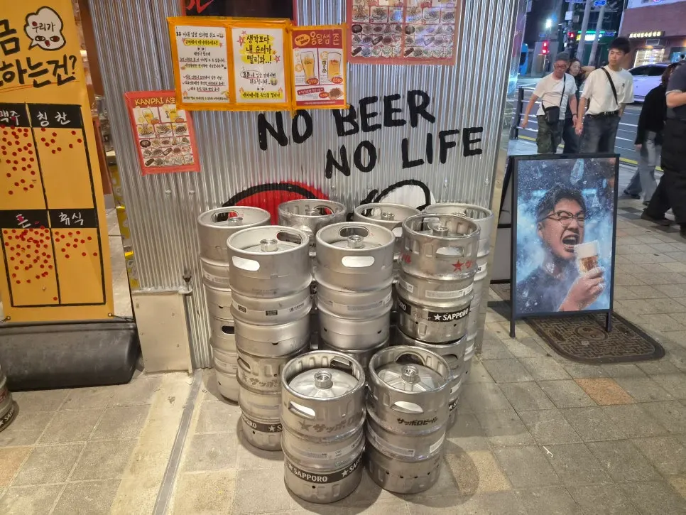 Sapporo draft beer kegs stacked at the entrance