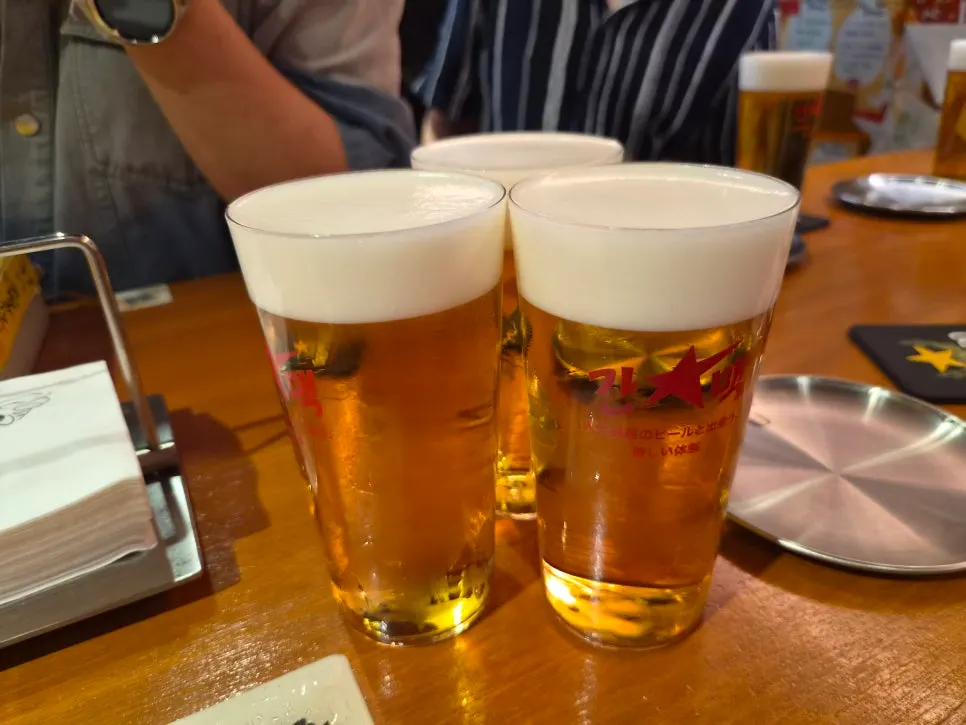 Several glasses of draft beer with creamy foam