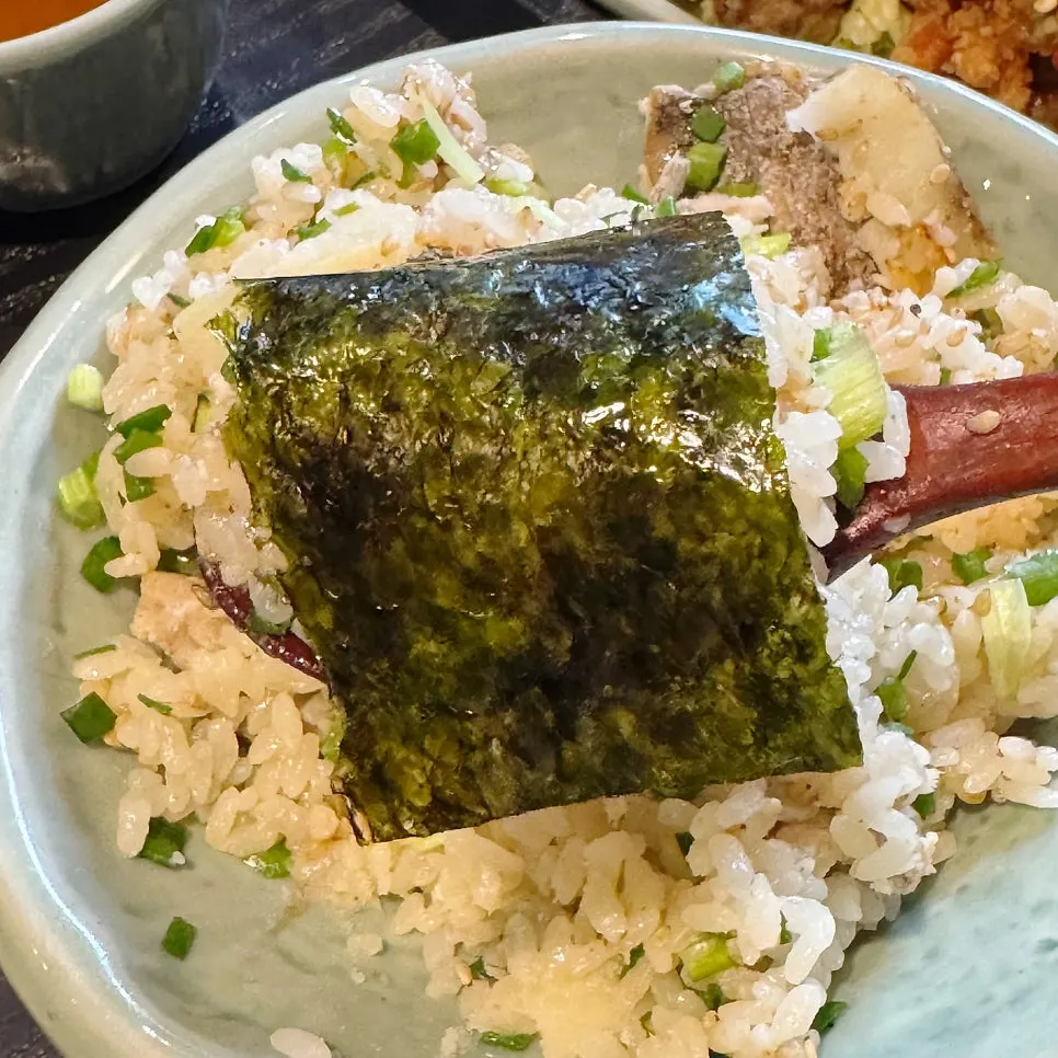 Boneless hairtail pot rice scooped into a bowl