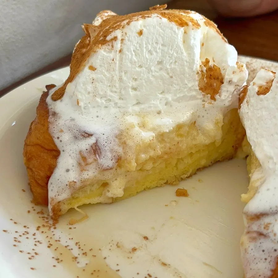 French toast topped with cinnamon powder and maple syrup