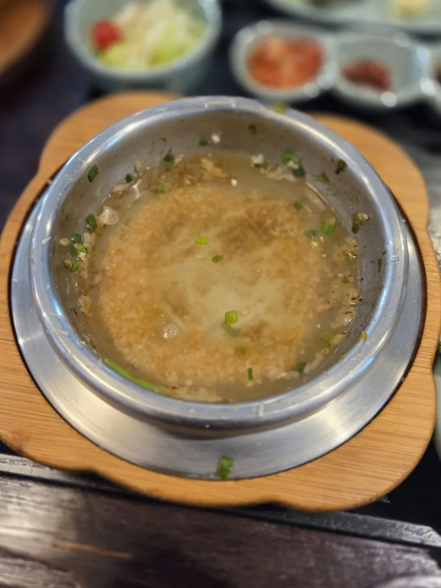 A bowl of lobster shrimp pot rice scooped out of the pot