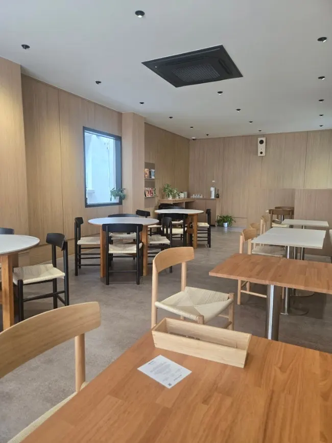 Sunlit café spaces across two floors