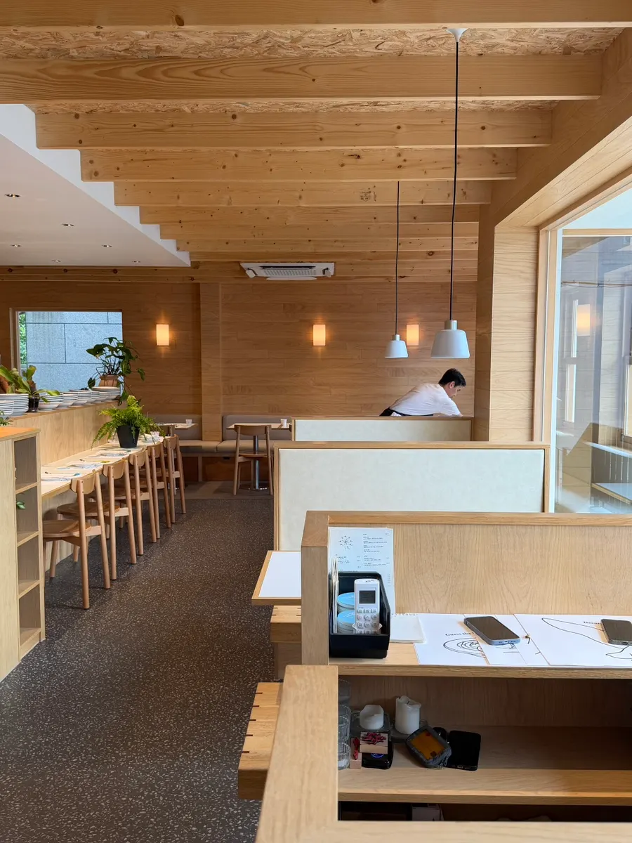 Interior of Extra Mile in ivory and beige tones