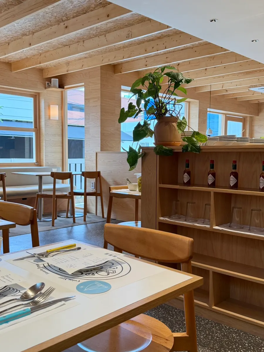 Bar seat with a view of the pizza-making process