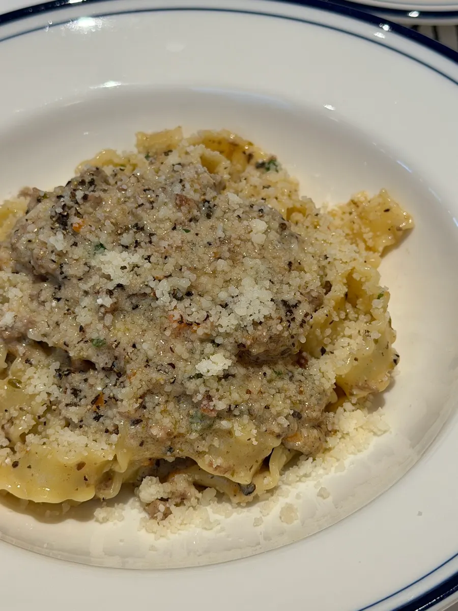 Close-up of the wide noodles in white ragu pasta