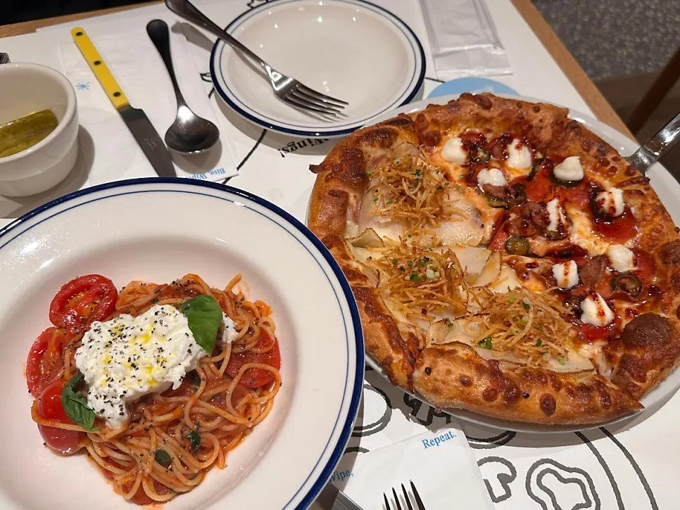 Extra Mile's Classic Combo with half-and-half pizza and tomato pasta