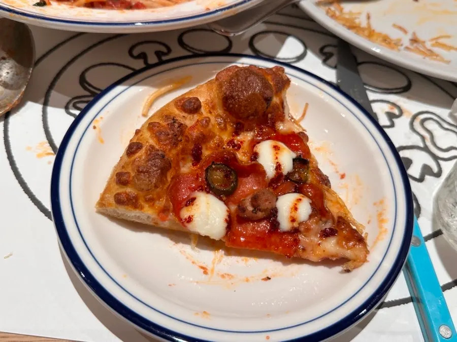 Pizza and pasta placed together on the table
