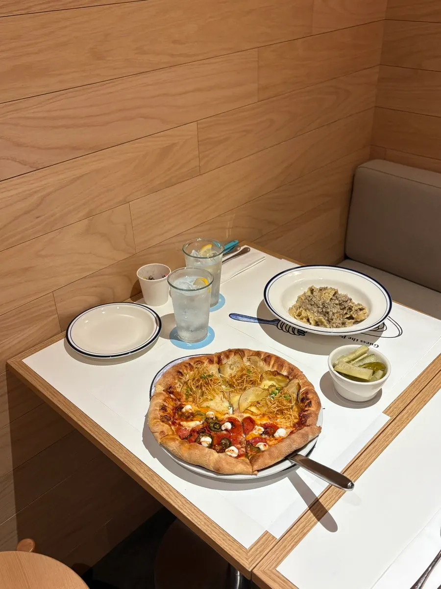 Extra Mile pizza and pasta menu board
