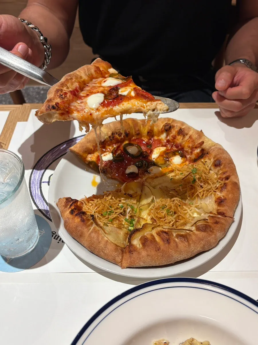 A slice of hot honey pepperoni pizza