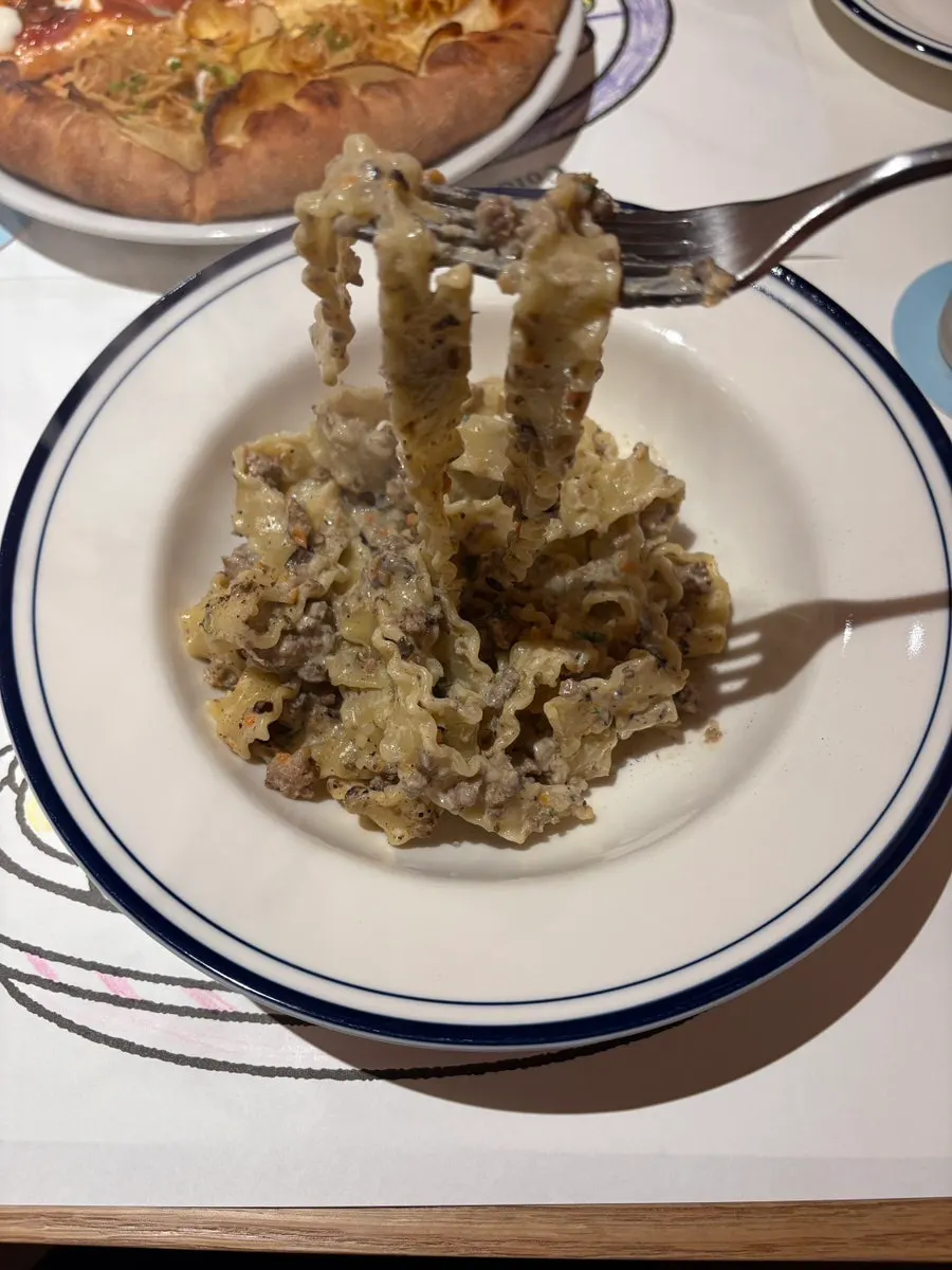 White ragu pasta loaded with meat
