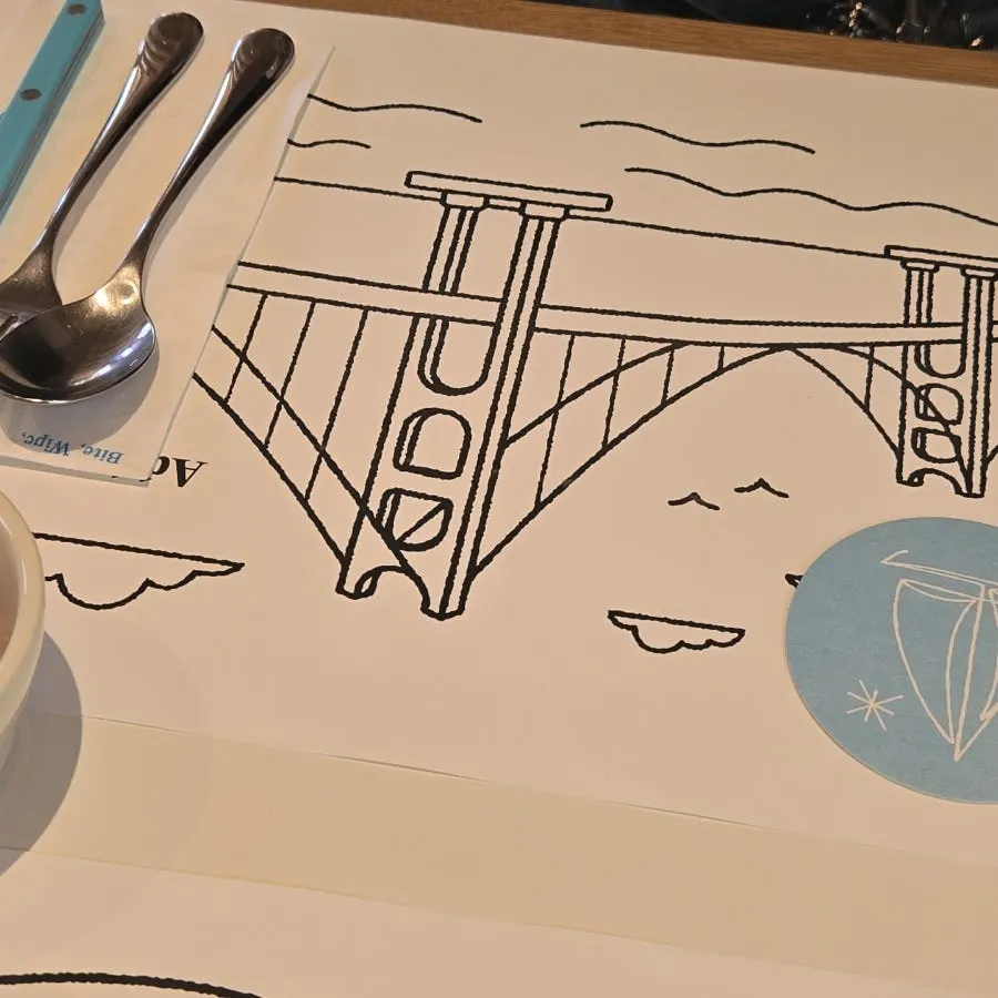 Two coloring pages laid out on the table
