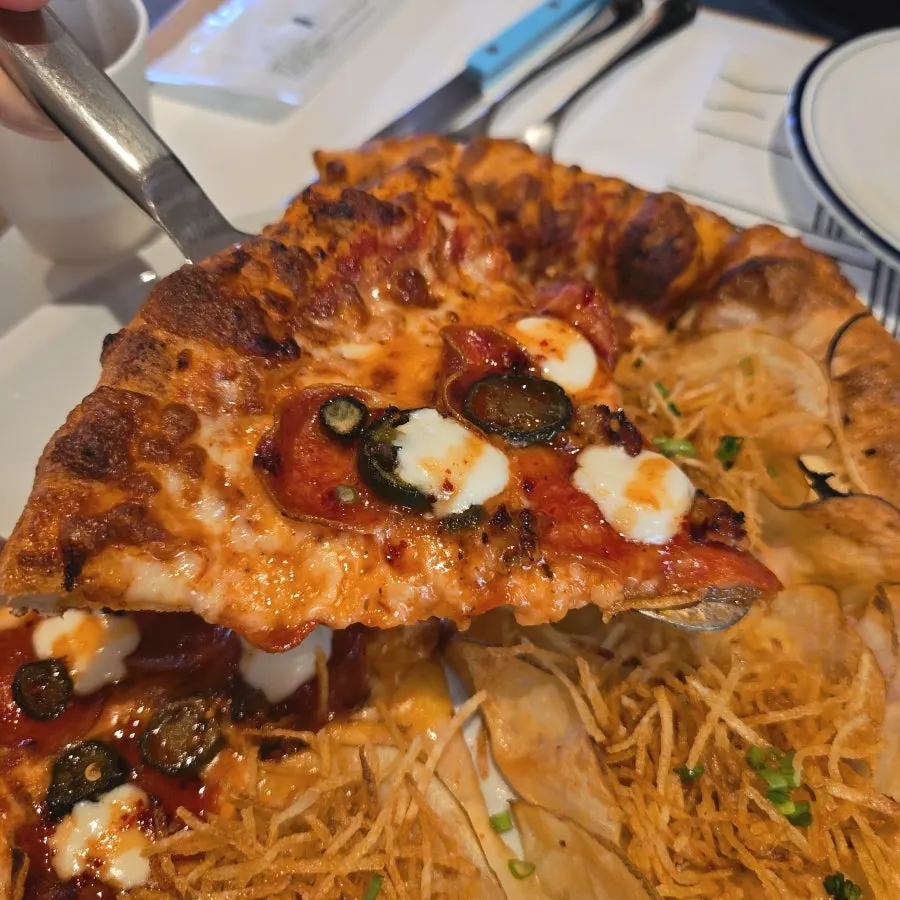 Close-up of pepperoni and cheese on the pizza