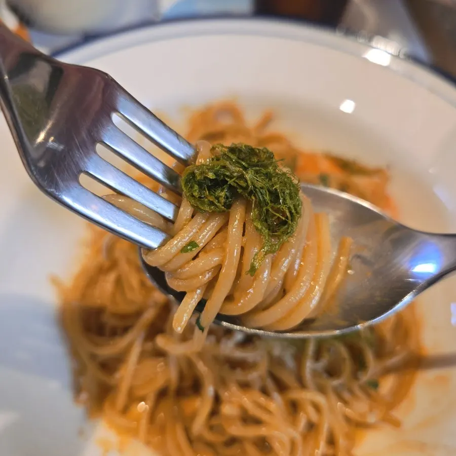 Roasted gamtae placed on top of the pasta
