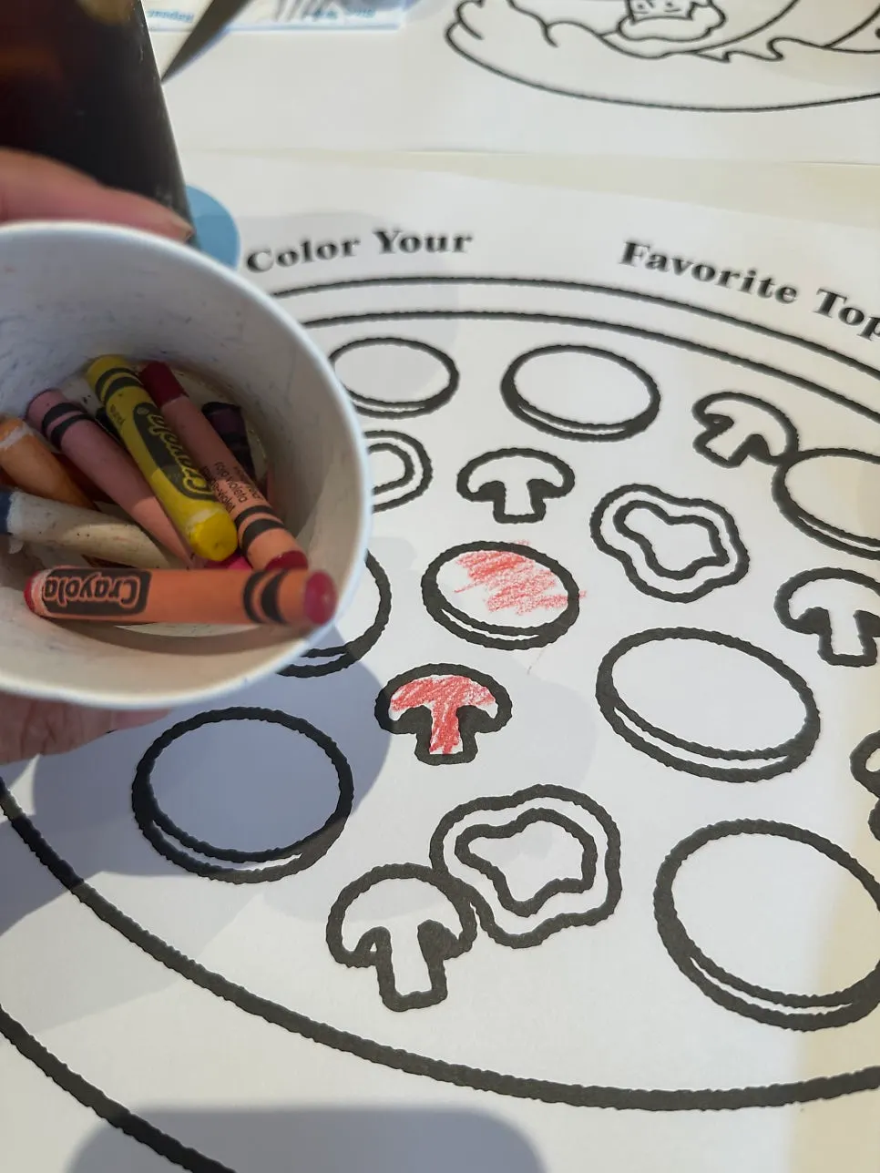 A coloring illustration placed on the table