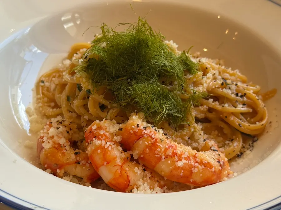 Bisque cream pasta topped with shrimp