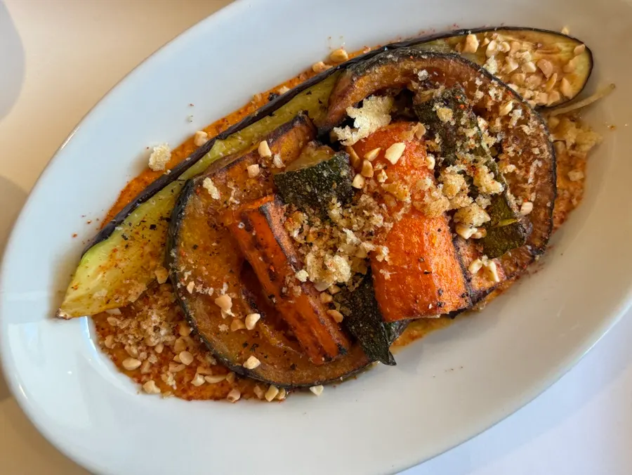 Romesco grilled vegetables topped with nuts