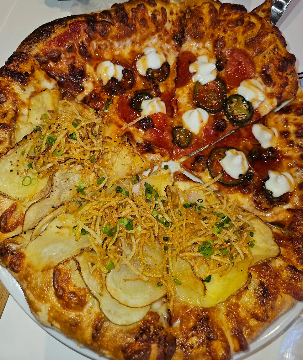Pepperoni and jalapeño half of the pizza