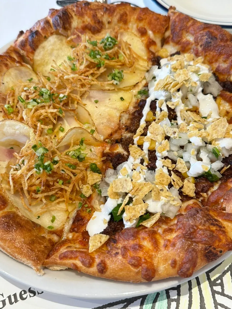 Half-and-half potato and birria pizza