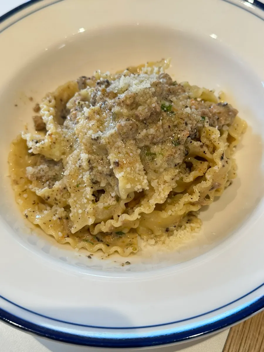 A plate of white ragu pasta