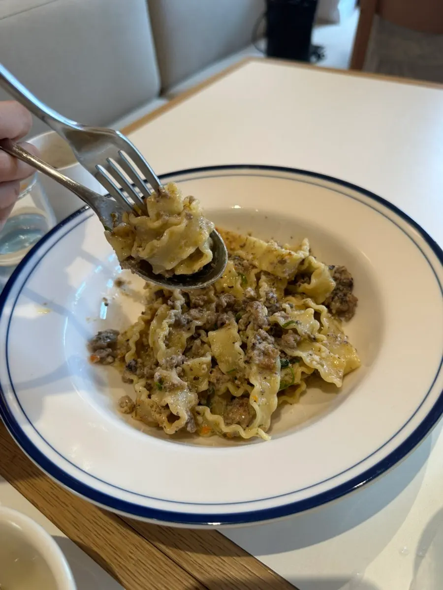 White ragu pasta twirled on a fork