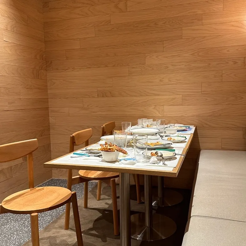 Two-person table in the back of Extra Mile