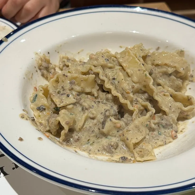 White ragu pasta with wide curly noodles