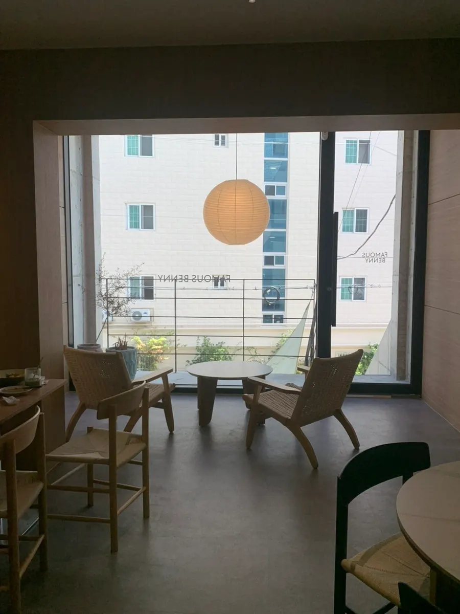Lounge chairs and low tables by the 2nd-floor windows