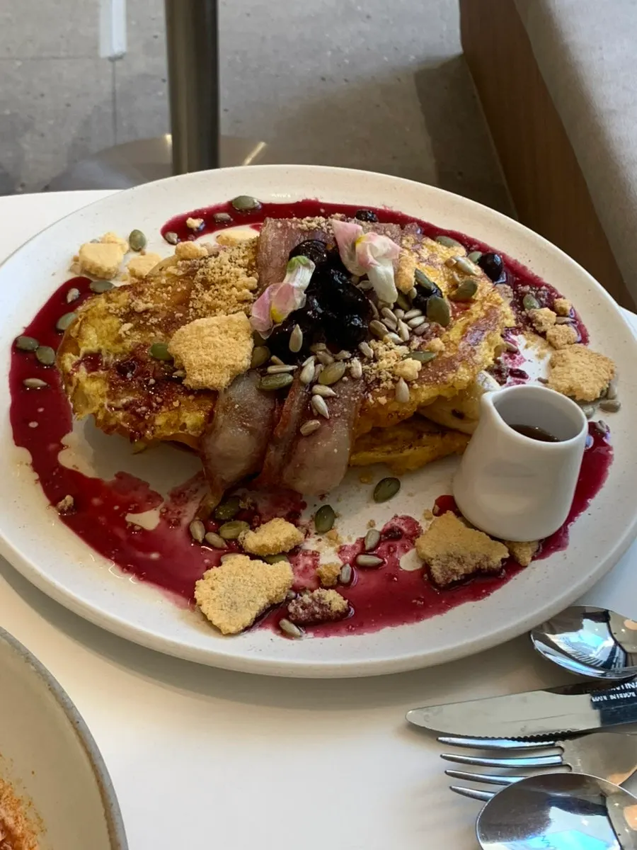 French toast made with croissant and topped with crumble