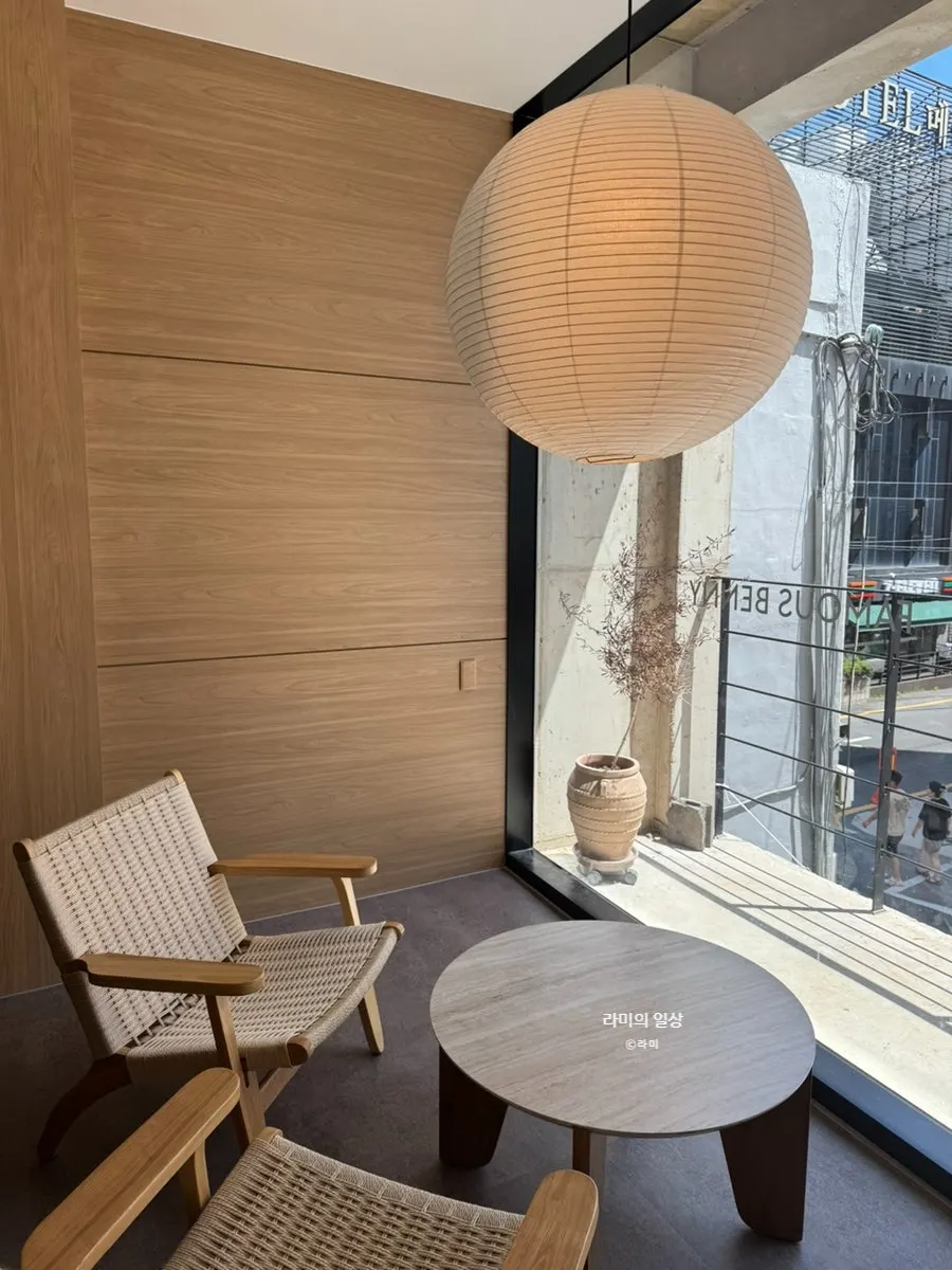 Wood-toned space leading to the café's second floor